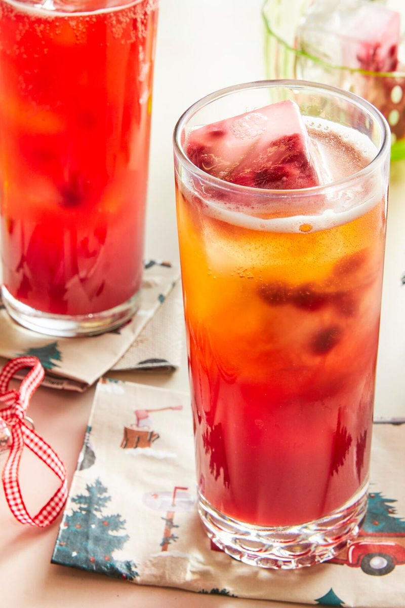 a glass of red and orange punch