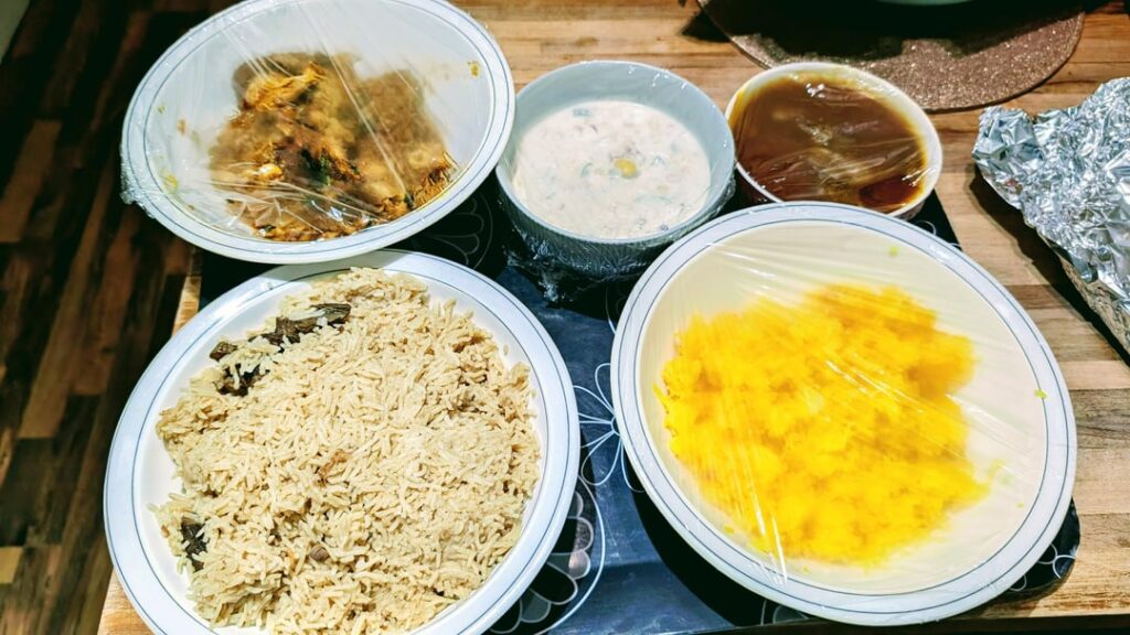 Neighbours gave me a Feast of Pakistani dishes (chicken roast, biryani, beef curry, sweet rice, chickpeas)