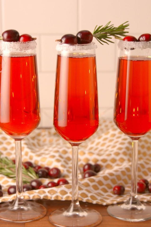 red cranberry mimosa with cranberries on top