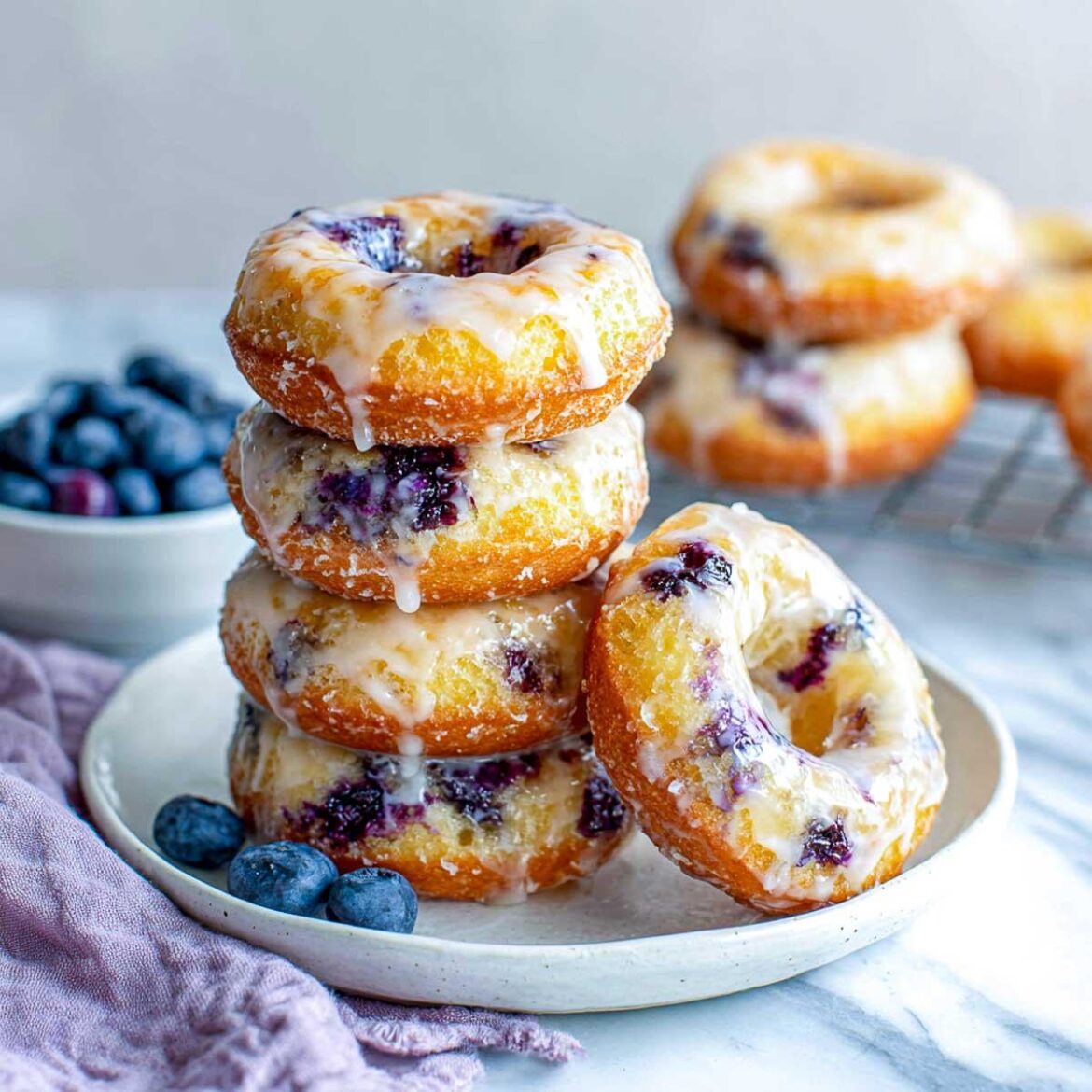 Air Fryer Blueberry Donuts with fresh blueberries and a light glaze. Easy homemade treat for breakfast or snacks.