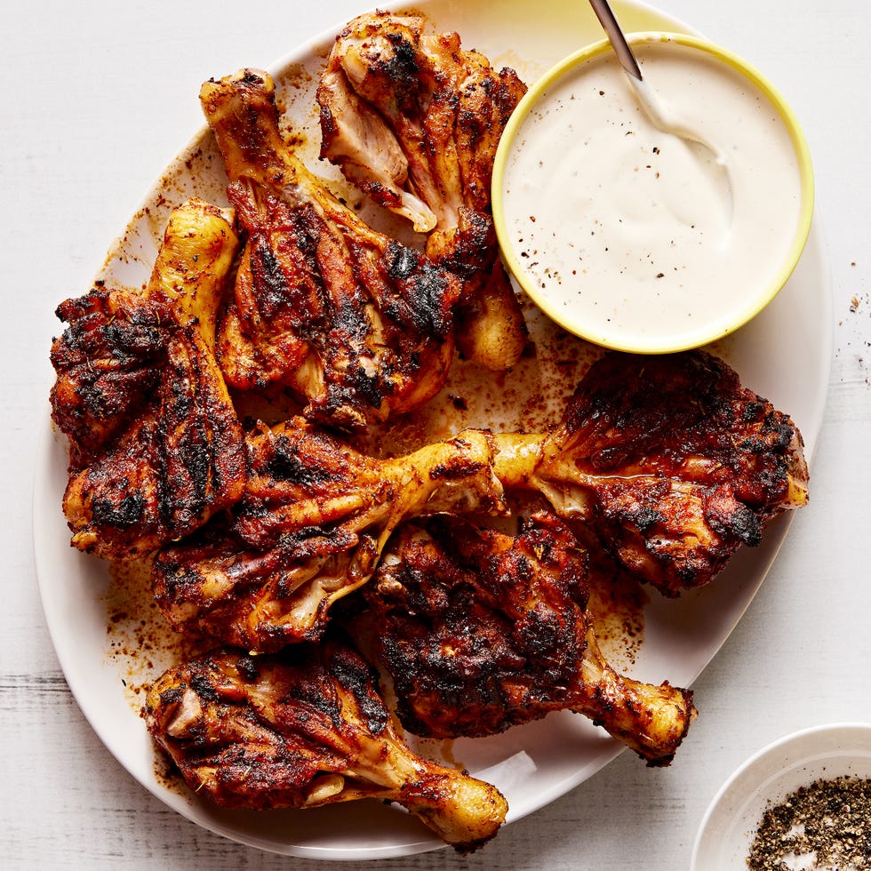 butterflied chicken drumsticks seasoned with brown sugar, smoked paprika, chili powder, garlic powder, and dried thyme and grilled until tender and charred then served with alabama white sauce