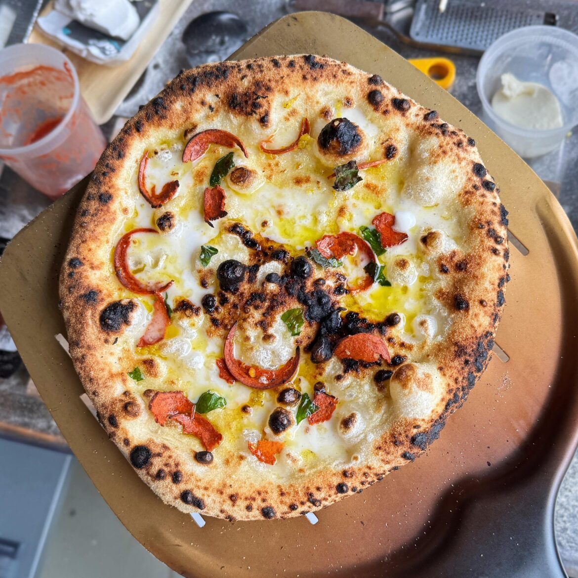 Vegan feta, pepperoni, olive pile, lemon zest, garlic, basil