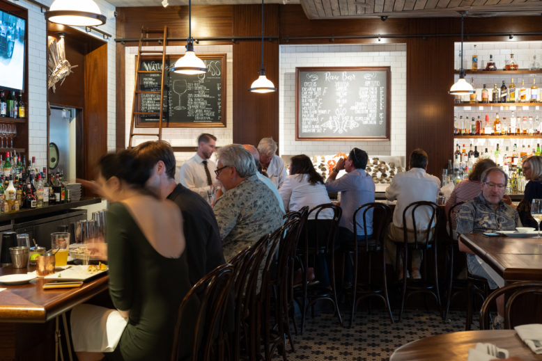 Patrons dine, drink and mingle at the seafood-forward Dock's Oyster Bar in Atlantic City