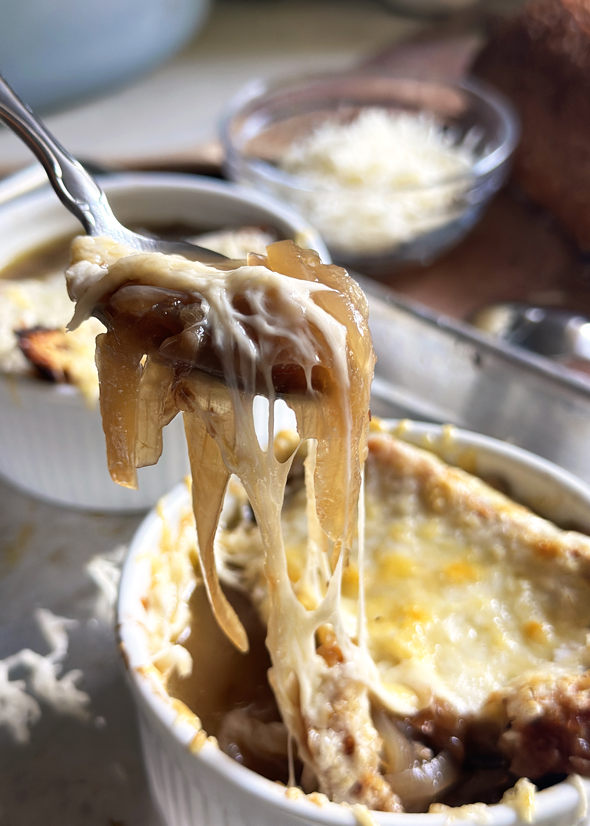 French Onion Soup spoon cheese pull