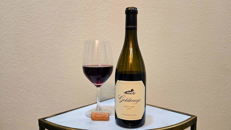 Bottle of Goldeneye pinot noir and glass