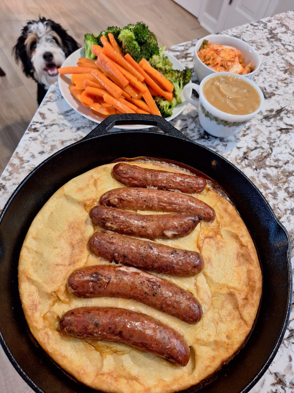 Murican attempt at toad in a hole. Pretty disappointed with the lack of rise. The curry onion gravy was tasty though