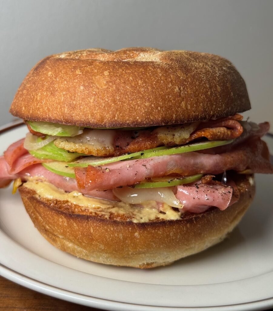 Pan fried ham, Swiss, thin-sliced Granny Smith apples, pickled shallots, Dijon, Kewpie.