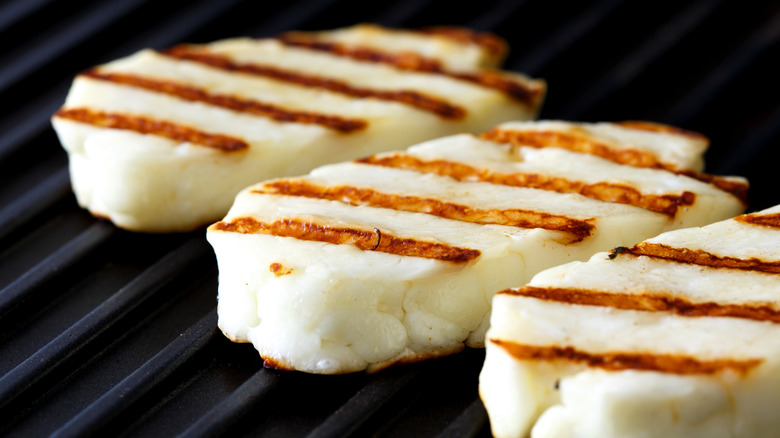 Halloumi cheese slices on grill