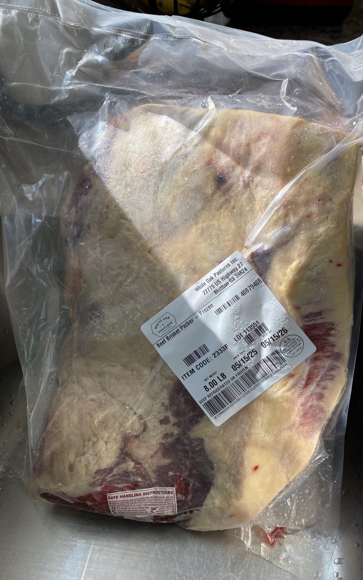 How can I defrost an 8lb brisket to be ready for the smoker tonight?