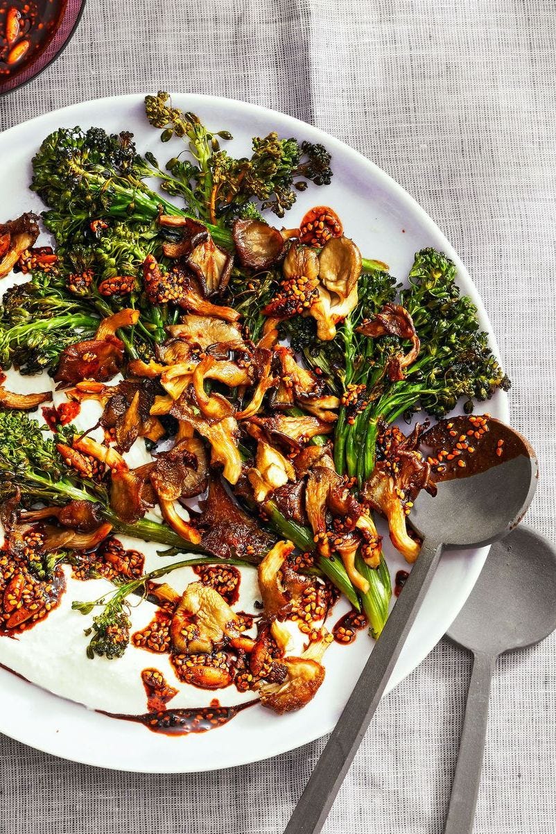 healthy air fryer roasted broccolini and mushrooms on a white plate