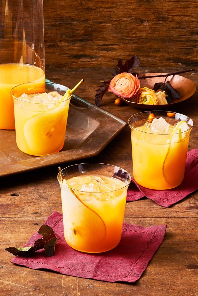 glasses of fall punch on a wooden table