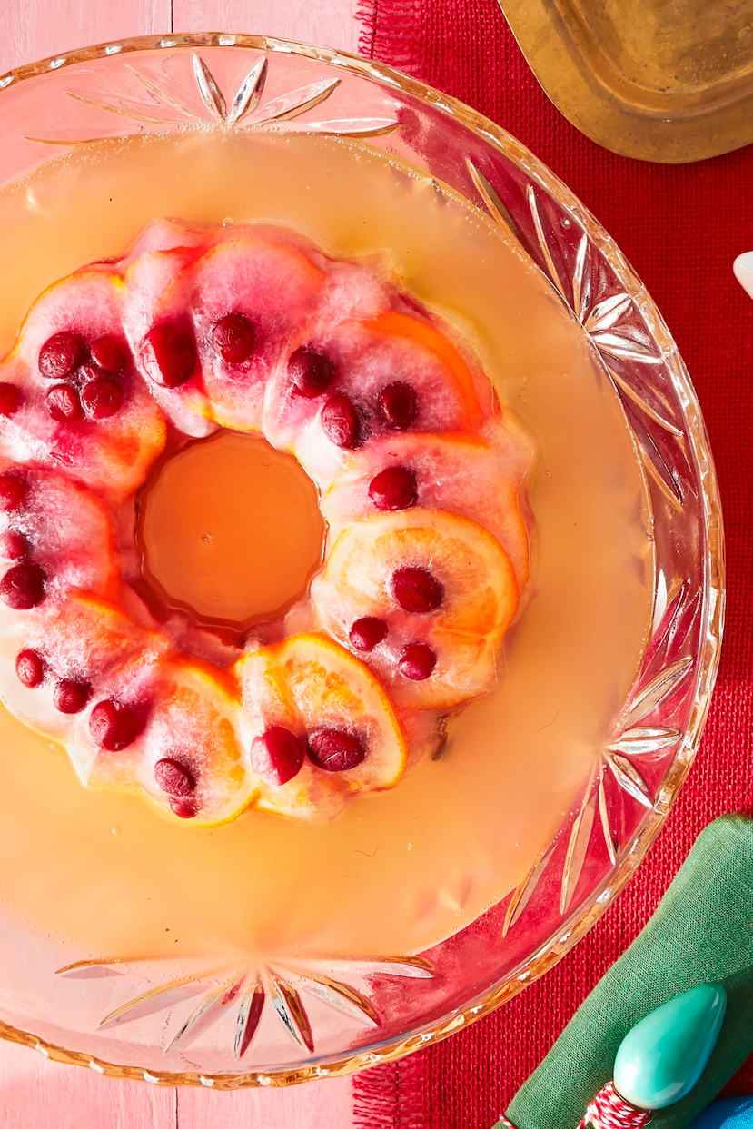 sparkling pear and orange champagne punch in a crystal bowl