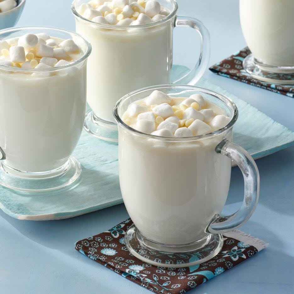 white hot chocolate in glass mug