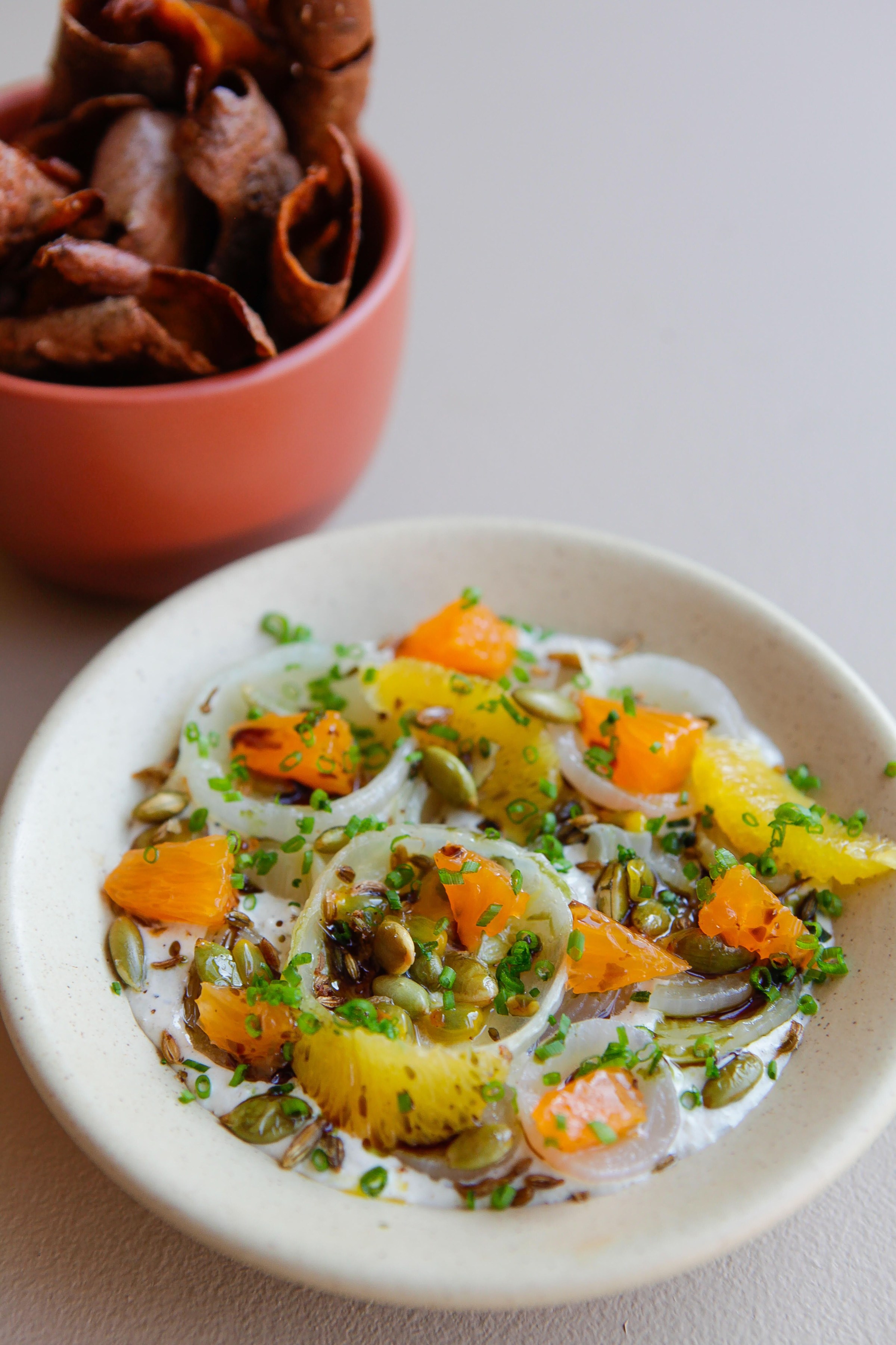 Hunky Dory’s onion dip and chips: cipollini onions, mixed seeds, tangerine, potato chips, and fried sweet potato skins