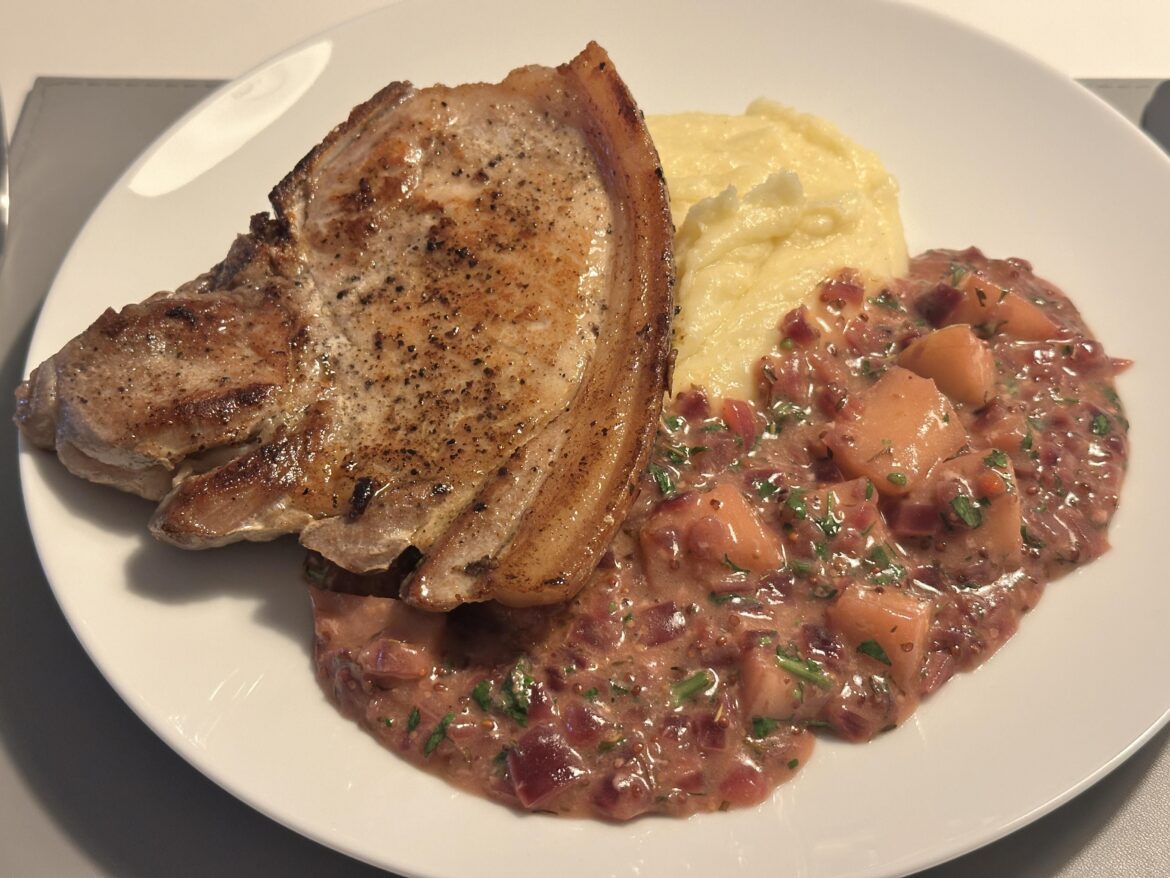 Pork chop served with mash and an apple & mustard sauce