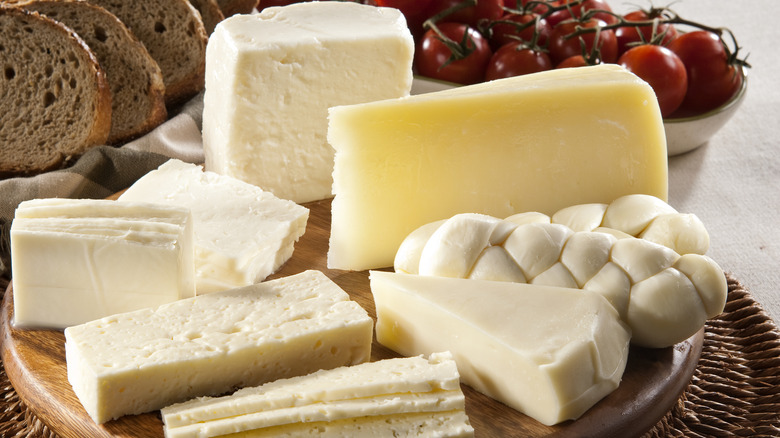 A board full of different cheeses.