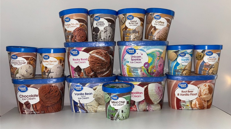 15 tubs and pints of Great Value ice cream stacked on white table