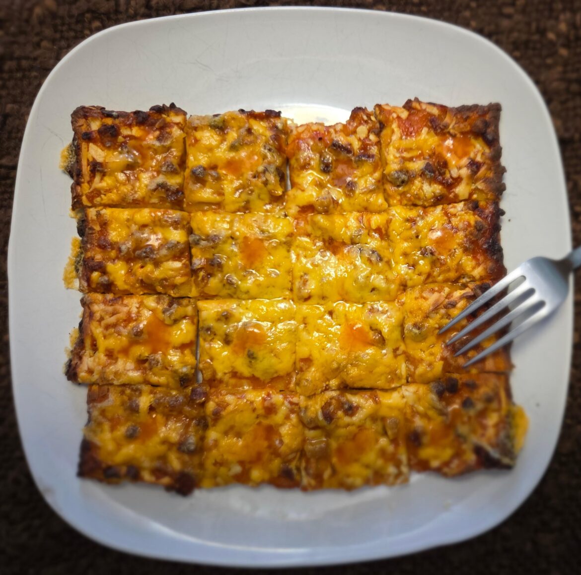 Totino's, supplemented w/ sharp cheddar— one drop of hot sauce per bite