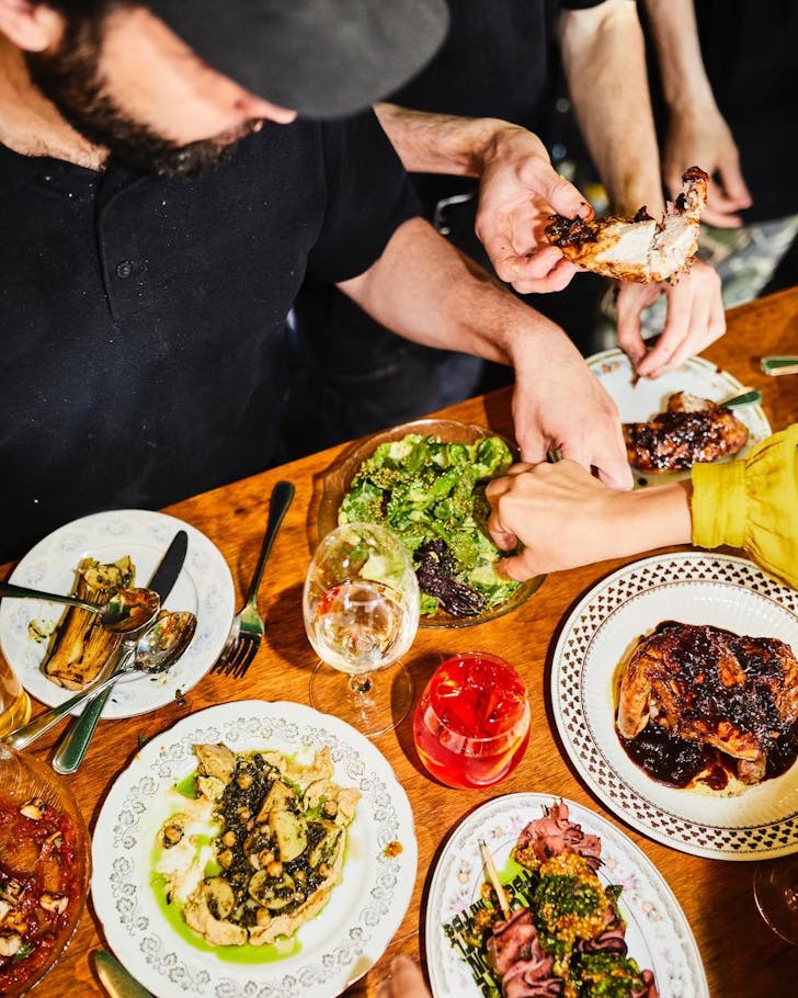 Someone tucking into an Italian spread at Testun