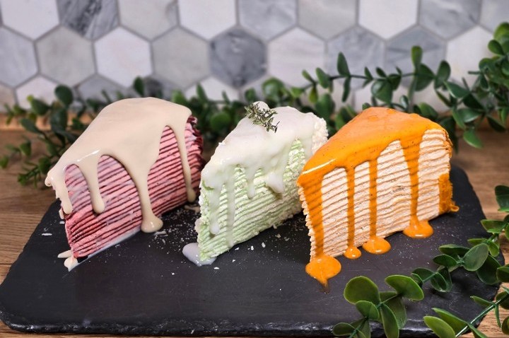 Three cake slices from U:Dessert Story in San Francisco.