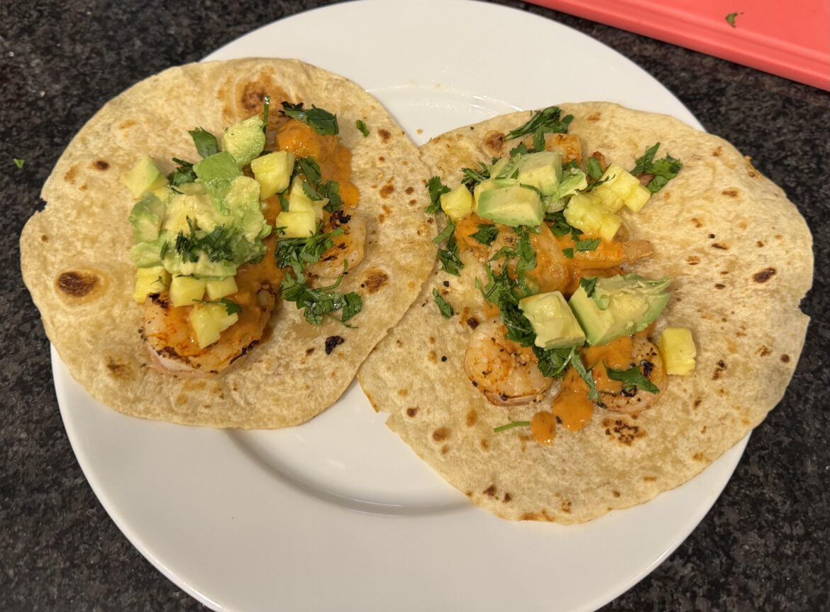 Grilled shrimp with pineapple chipotle sauce, topped with avacado, pineapple and cilantro