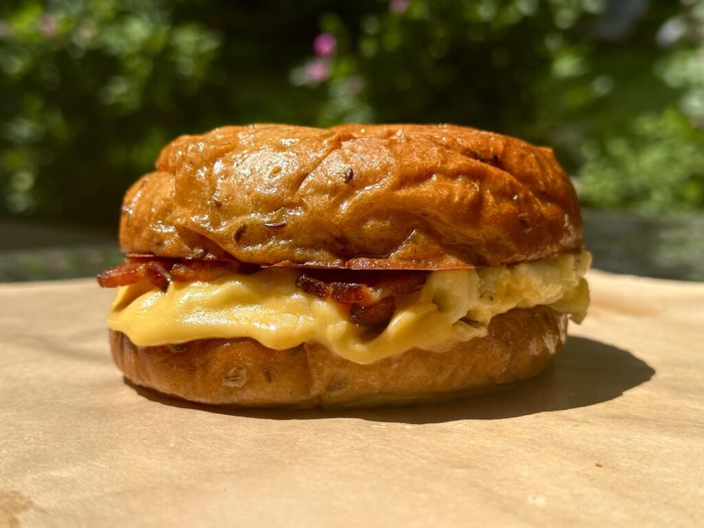 Bacon, egg, and cheese on a homemade rye bun