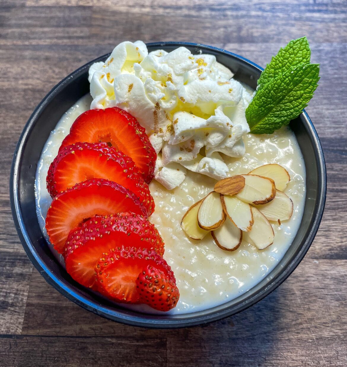 Tapioca pudding w/ whipped cream + strawberries + mint + Gold glitter! 🍓🍃🍨✨