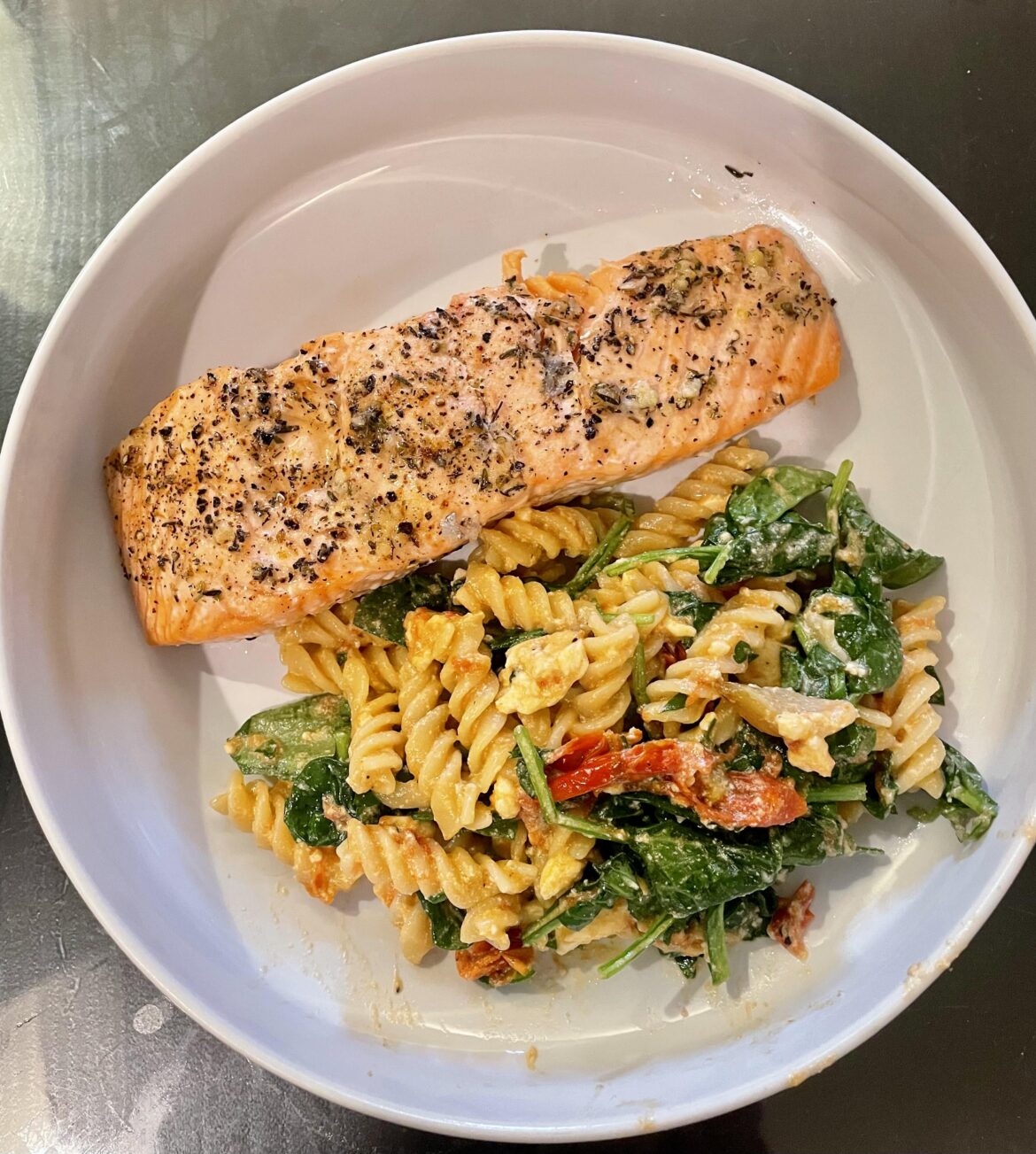 Baked lemon-y garlic salmon with baked feta, spinach and tomato pasta