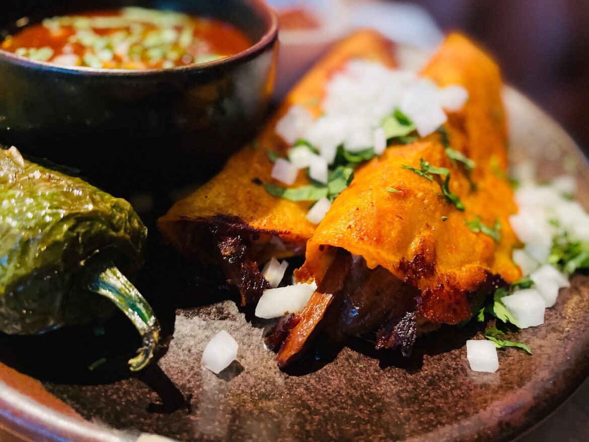 Quesabirria Tacos (slow cooked beef, melted cheese, consomme)