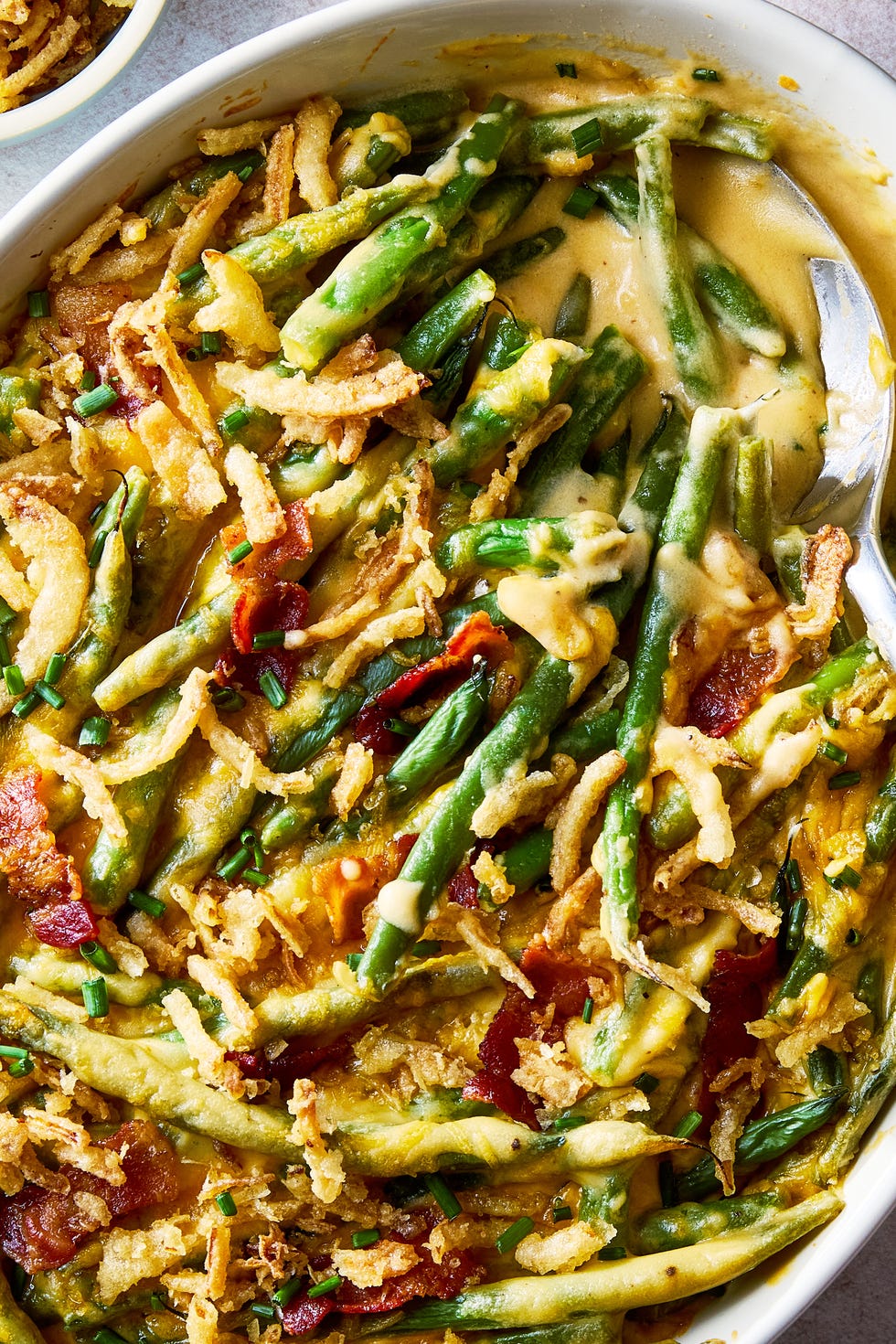 loaded green bean casserole topped with bacon