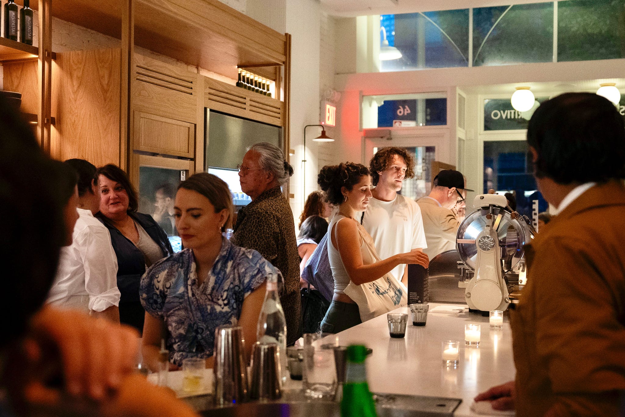 social gathering at a bar setting with various patrons
