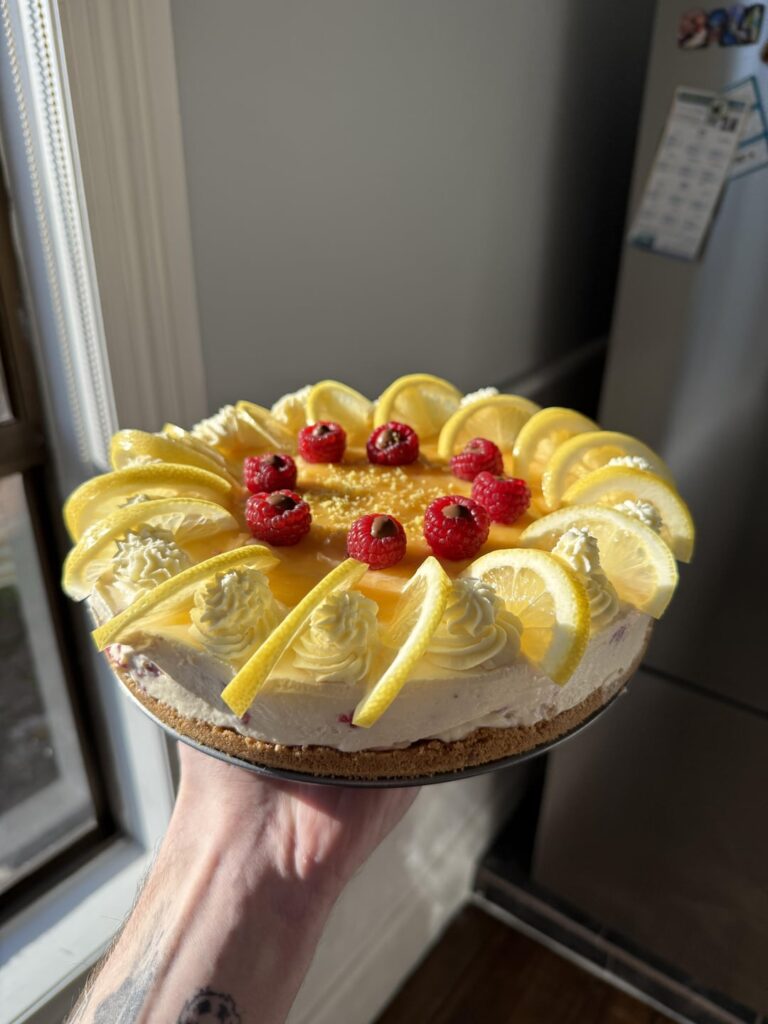 My wife wanted cheesecake, so i made a lemon and raspberry cheesecake with ferrero rocher filled raspberries and lemon curd ontop