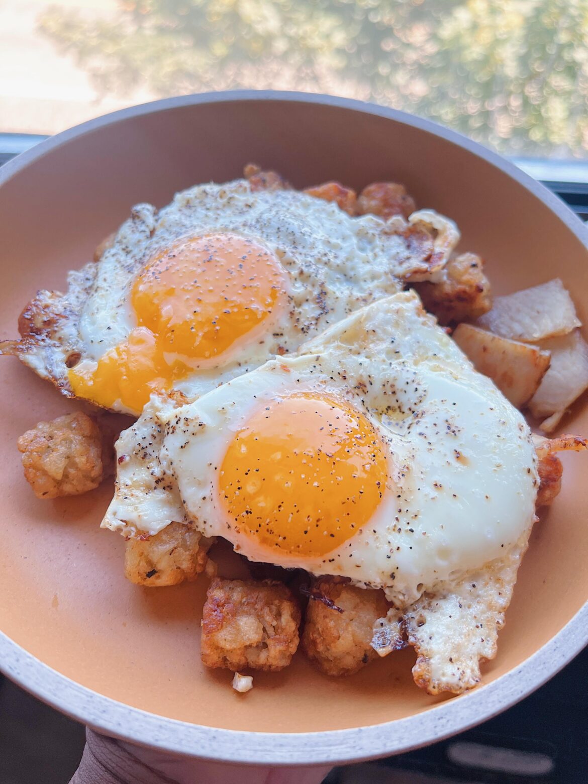 Eggs over leftover tots and deli meat