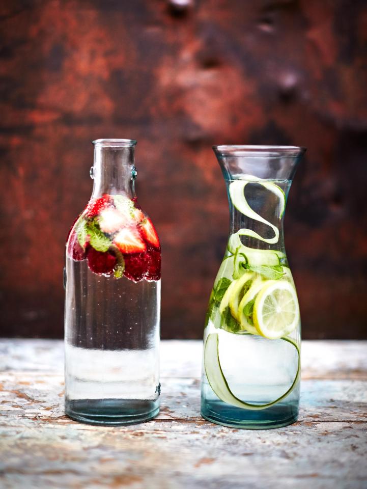  Half fill a reusable bottle with fresh fruit – slices of citrus or crushed berries work well – then top with water and freeze overnight