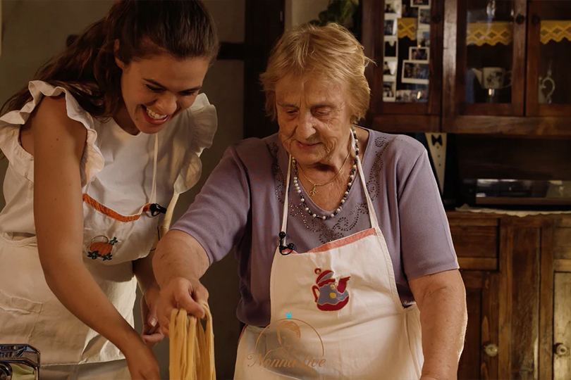Georgina Dufoix and another woman wearing aprons