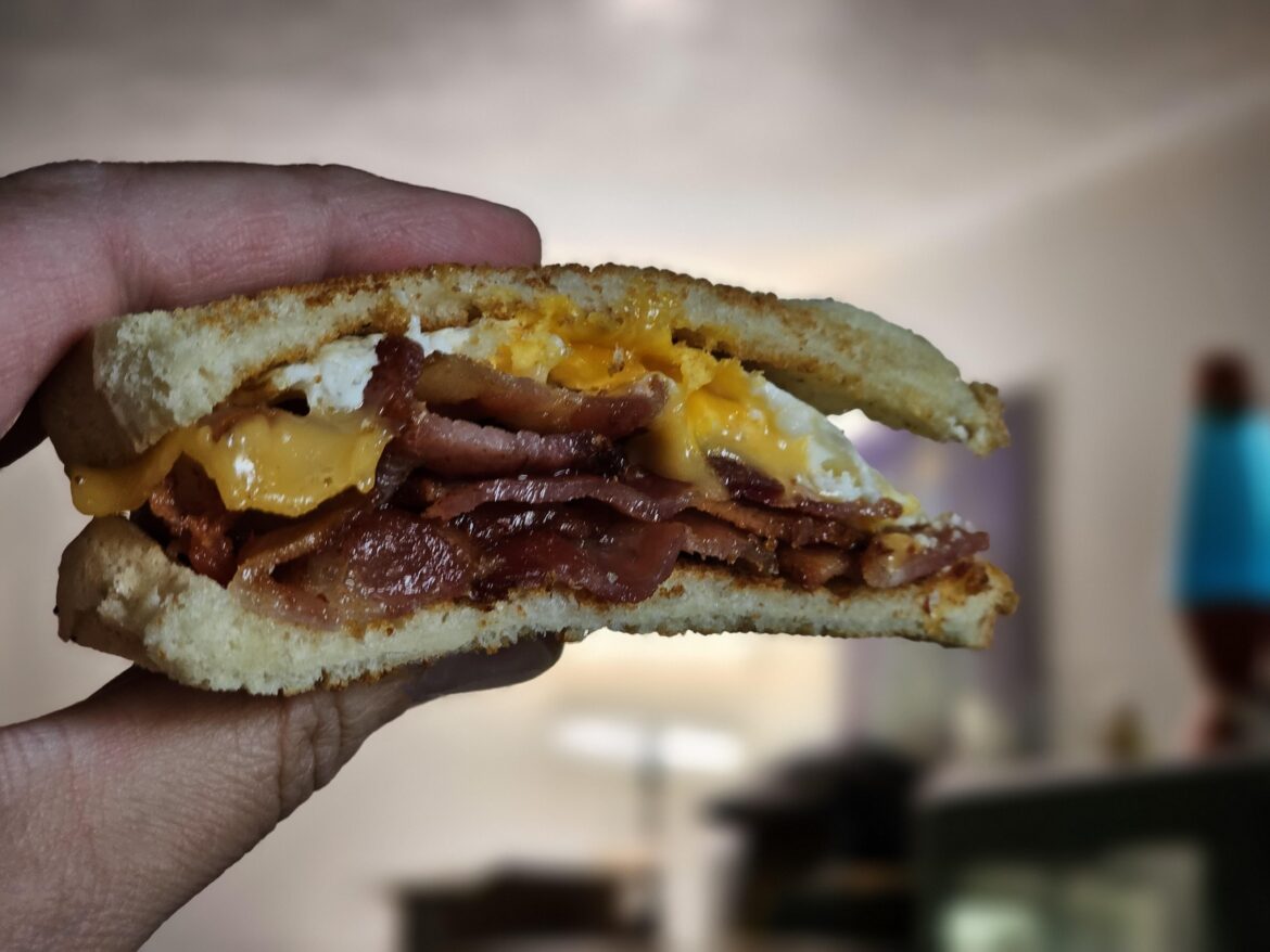 A simple sandwich for a simple man: bacon, egg, and cheese on toasted white bread.