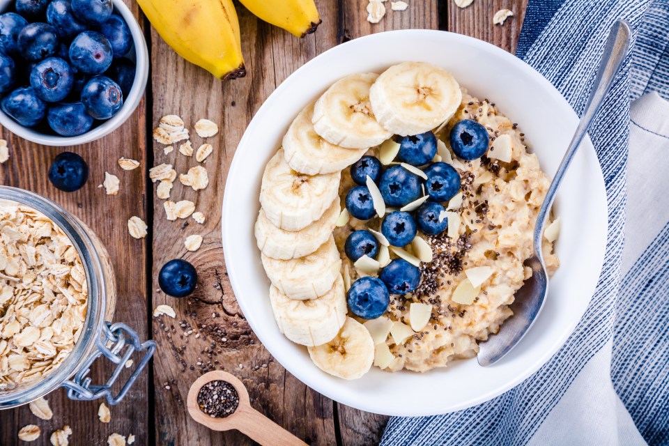 Oatmeal with banana, blueberries, chia seeds, and almonds.