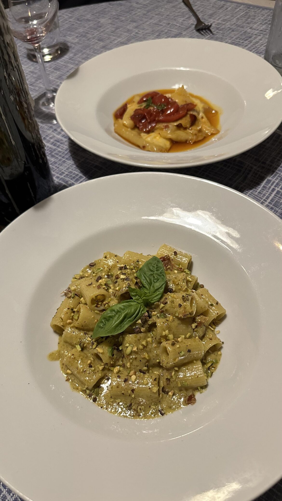 Mezzemaniche with dried tomatoes and pistacchio. Ricotta Ravioli with rabbit sauce.