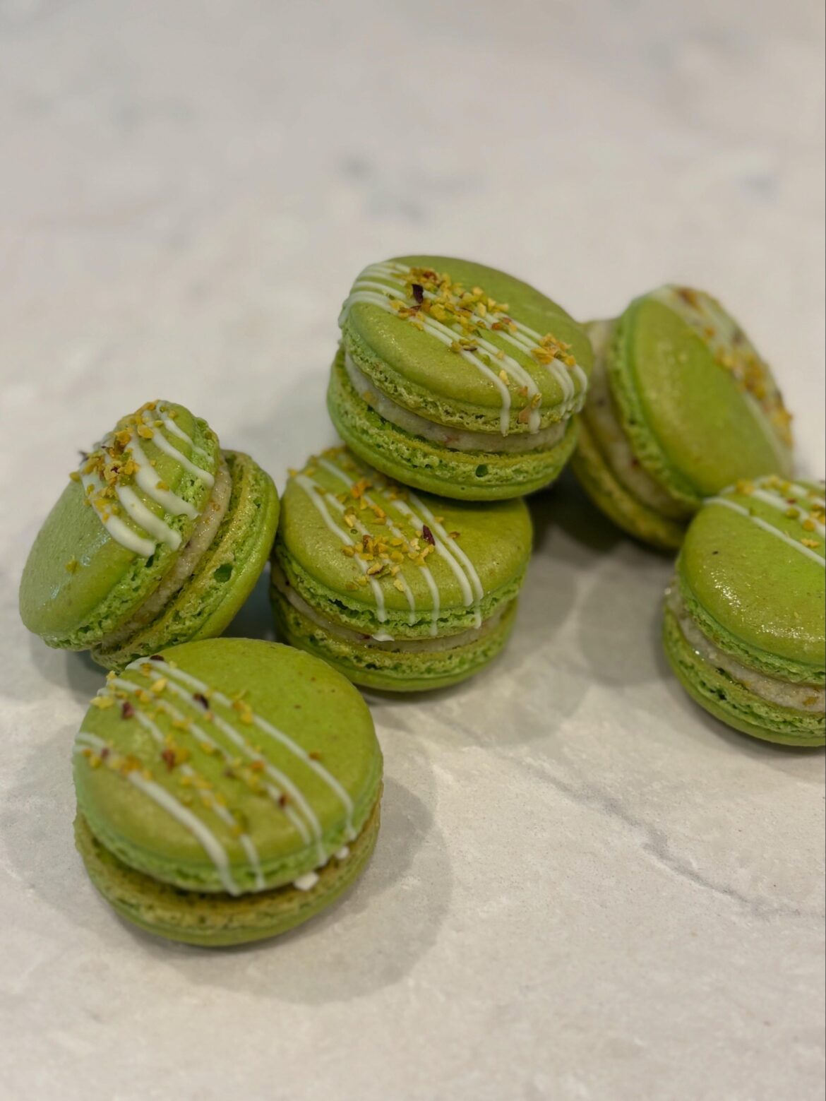 How much do you charge for a dozen macarons?