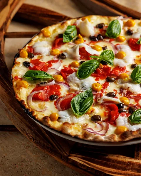 Andrea di Lorenzo A Rota in Tor Pignattara serves delicious Roman-style personal pan pizza tonda in classic and gourmet varieties (Credit: Andrea di Lorenzo)
