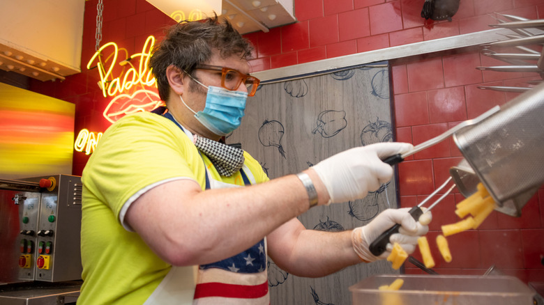 Pasta by Hudson owner Brandon Fay scooping pasta