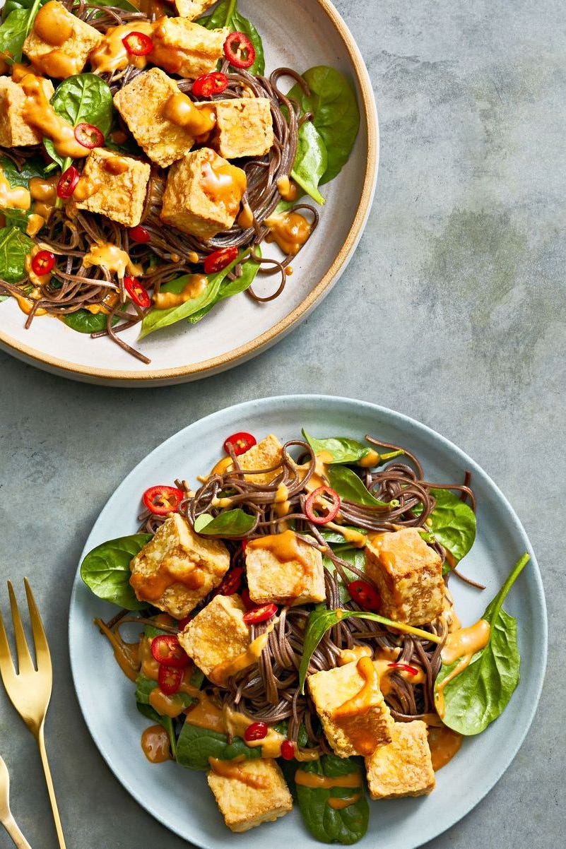 healthy italian marinated chicken over a bed of salad
