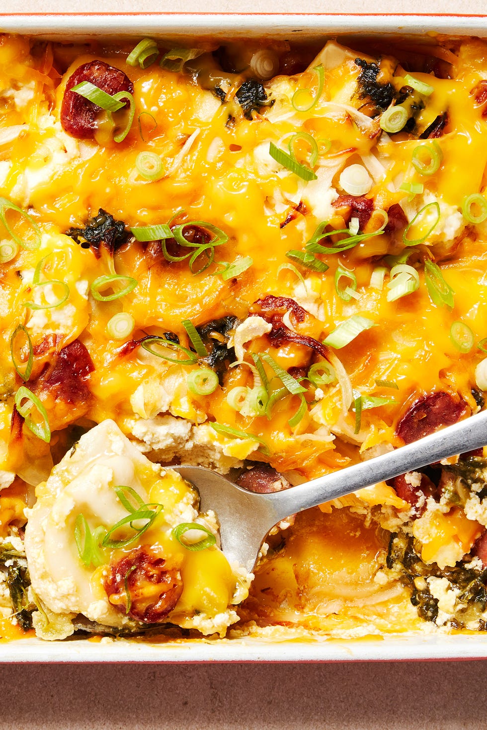 casserole dish filled with pierogis and cheese