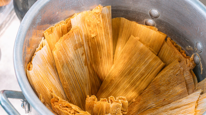 Freshly steamed tamales in a pot