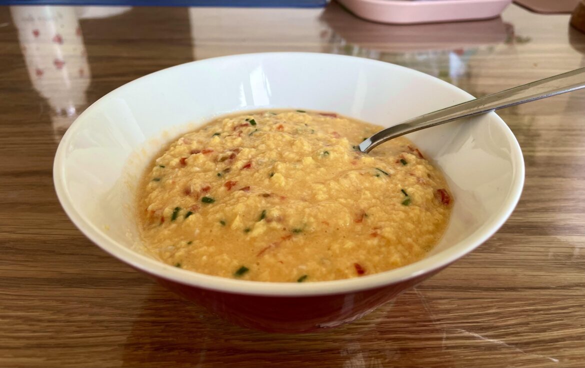 Soft scrambled eggs with chives, tomato, and creme fraiche