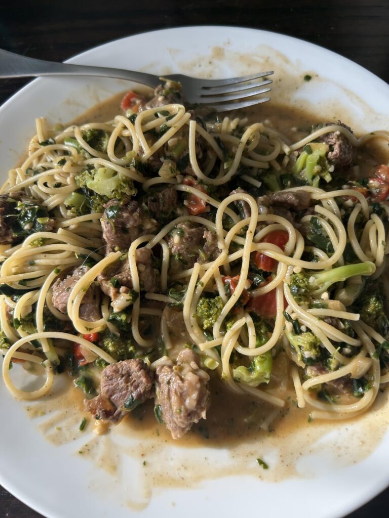 Steak bites with spaghetti and veggies