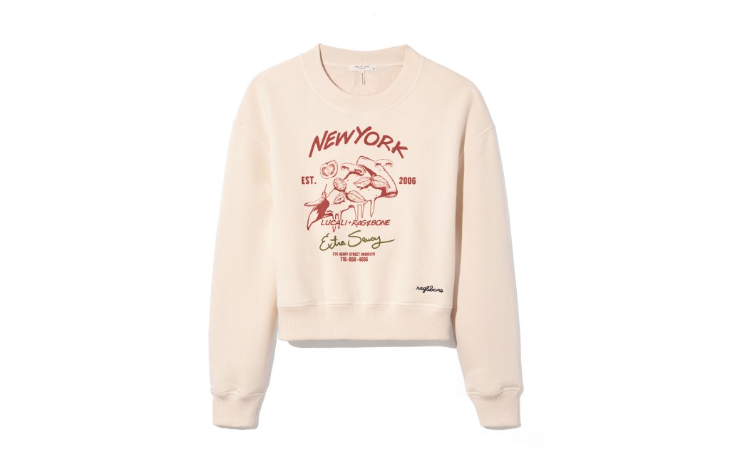 A white Rag & Bone sweater with red writing on it. 