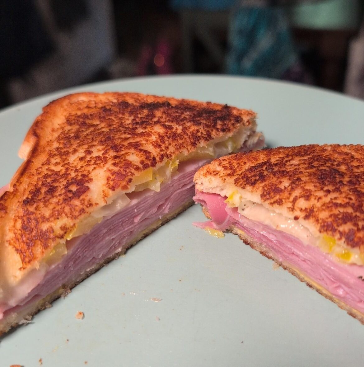 Parmesan crusted grilled ham and swiss with banana peppers