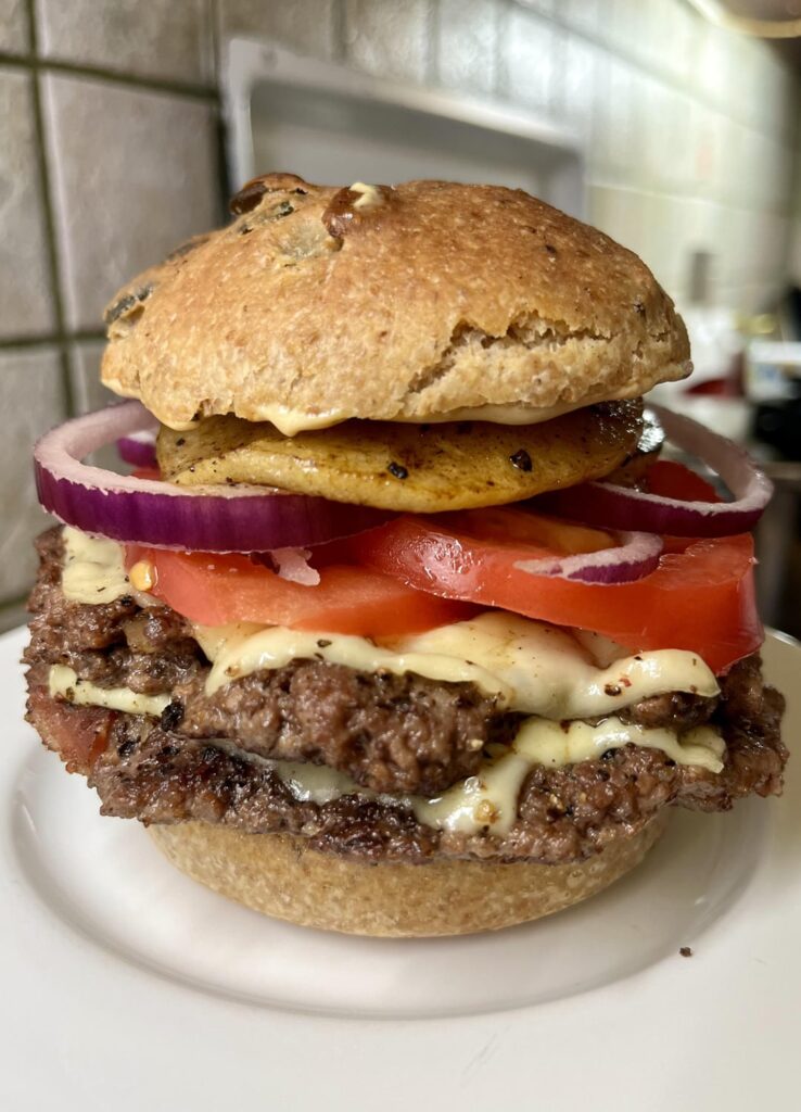 A whole wheat sourdough double pancetta cheeseburger with pumpkin seeds and roasted apple | THE FAT CHAMOIS