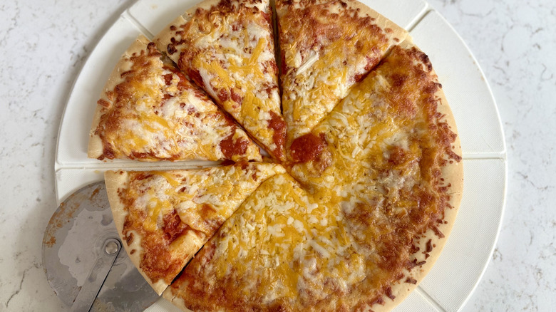 A sliced DiGiorno five cheese stuffed crust pizza